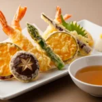 Make Best Crispy Tempura Appetiser at Home: 5 Simple Secrets Golden crispy Japanese tempura appetiser with shrimp and vegetables served with dipping sauce